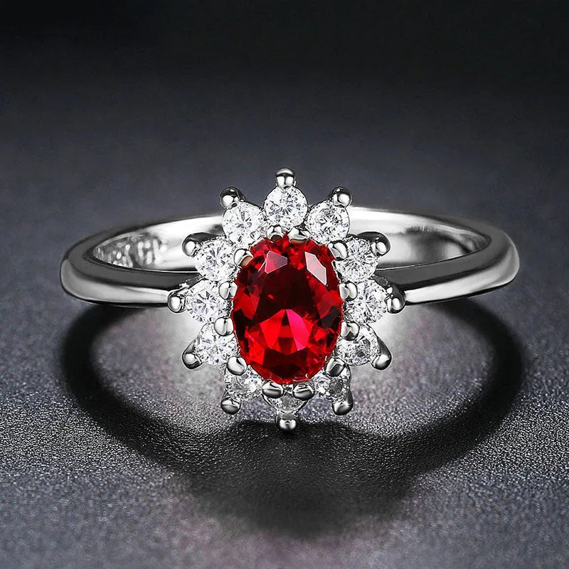 Women's blue moissanite flower ring in electroplated copper with inlaid zirconium, shown in green, blue, or red.