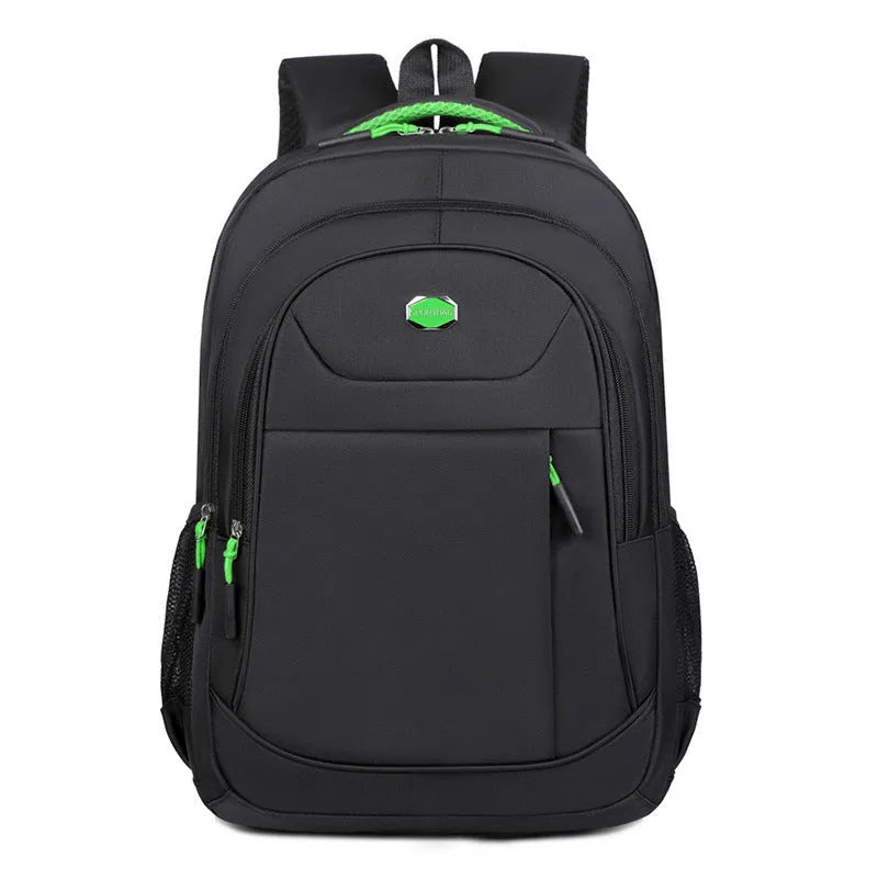 Solid colour Oxford cloth backpack with curved shoulder straps, shown in black, blue, green, or red.