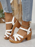 Plus size black Roman women's peep toe sandals with chunky heel and ankle buckle.