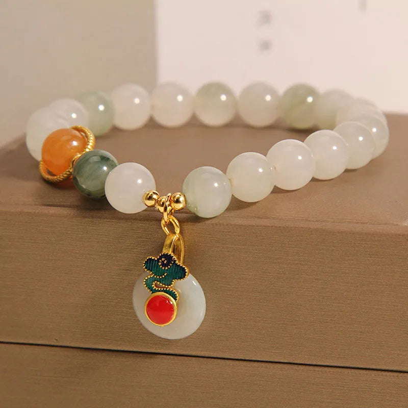 Ice jade bracelet for women with pearl charm and jade buckle in Chinese retro style.