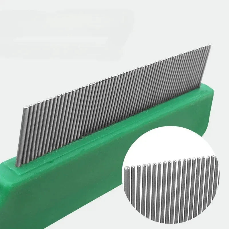 Green plastic handle flea comb with stainless steel pins for dogs and cats.