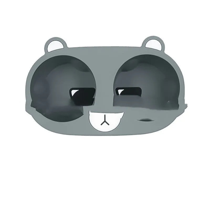 A grey silicone insert designed to fit into a car's central console cup holder to stabilise drinks.
