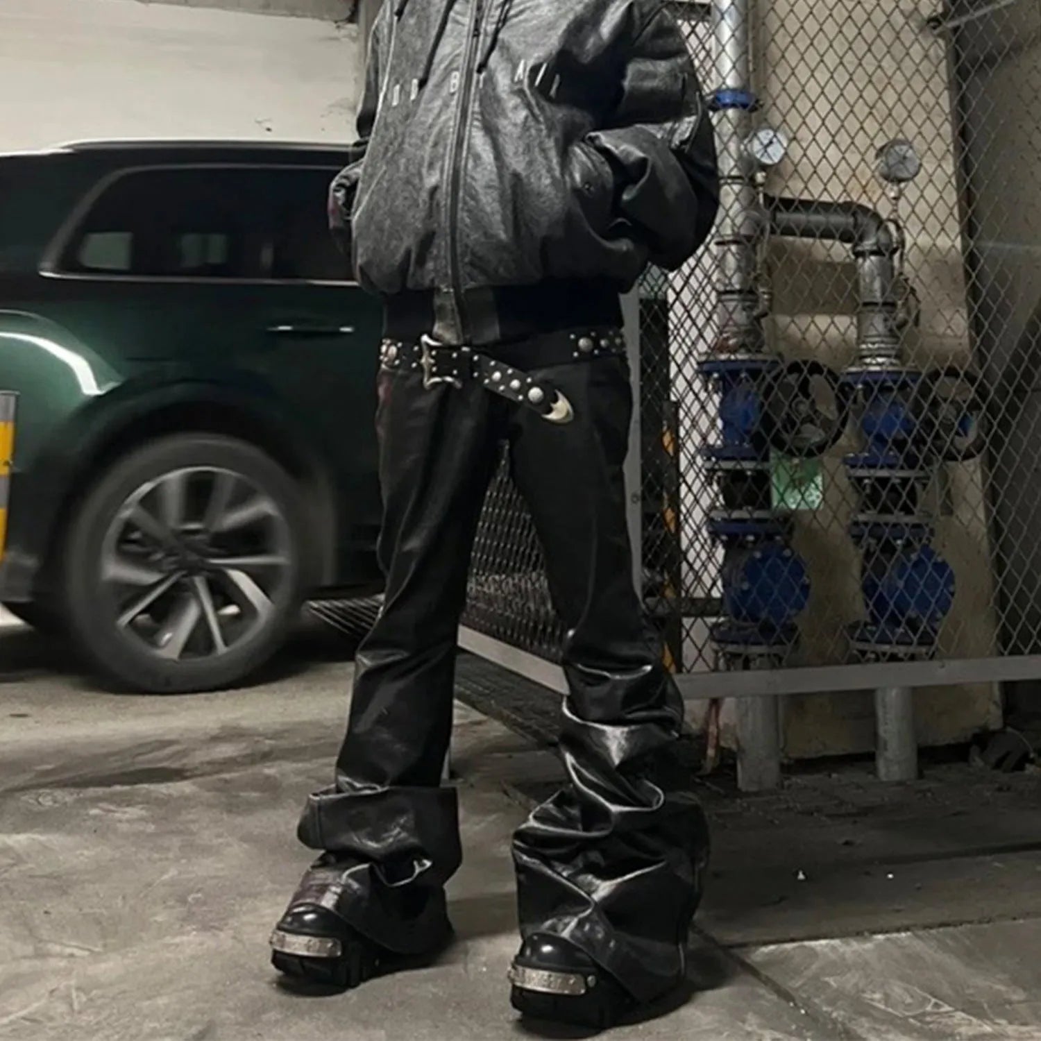 Black coated patent leather straight-leg jeans with shiny finish and cotton denim construction