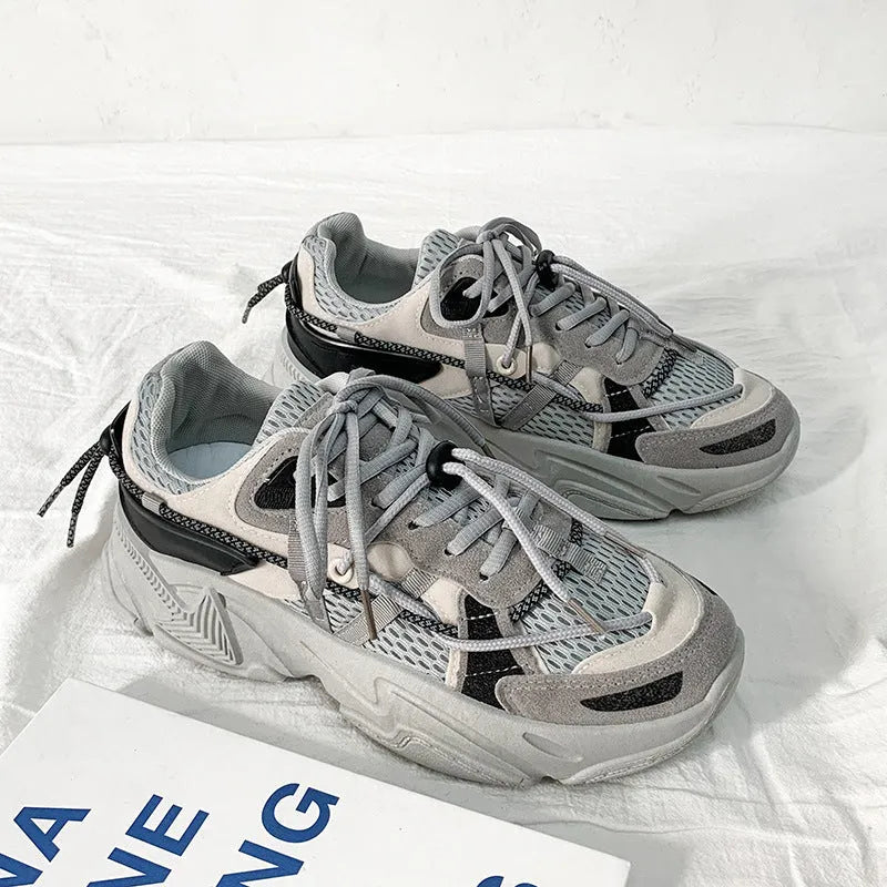 Men's white Korean style platform dad shoes with front lace-up closure on a neutral background.