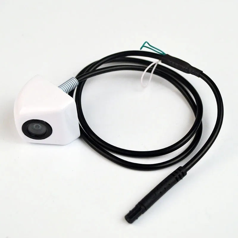 Black metal waterproof HD car rearview camera with integrated cable on a white background.