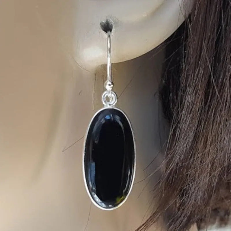 Women's earrings with oval black agate pendant and electroplated 925 silver geometric setting