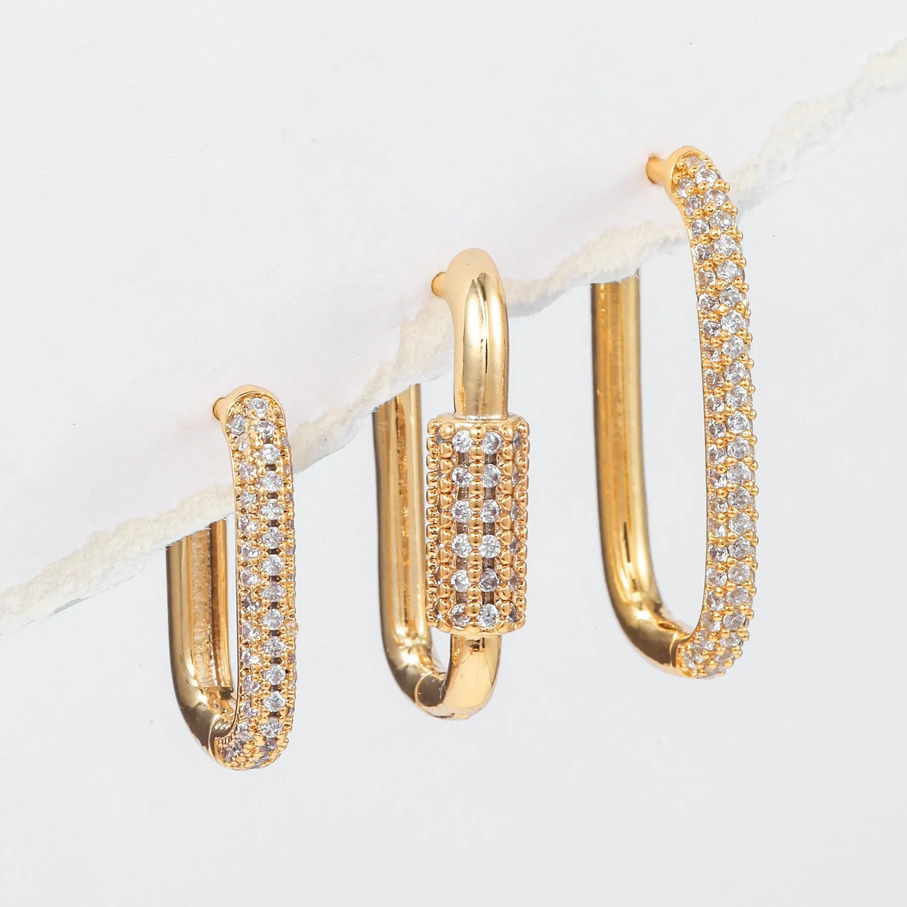 Three geometric ear clips with micro inlaid zircon stones in gold and white colour options