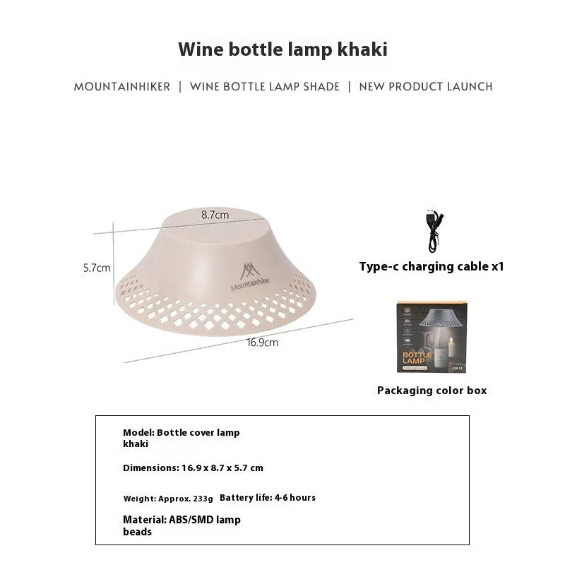 Beige wine bottle shaped camping lantern with USB-C port and adjustable light settings on a wooden table.