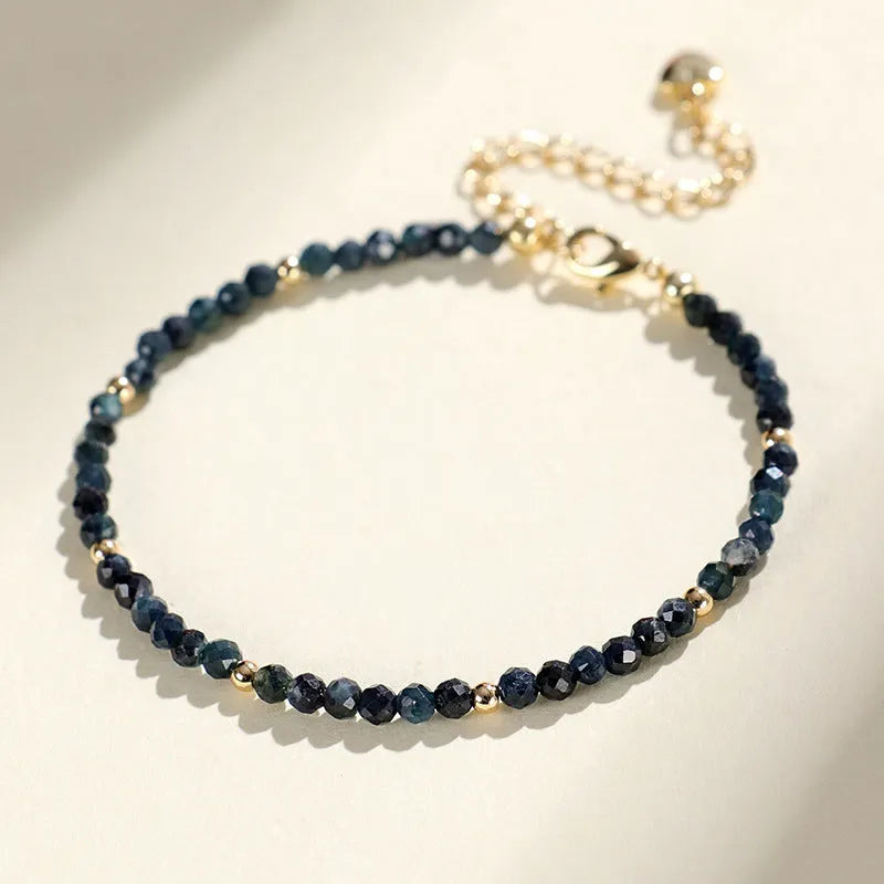 3mm blue tourmaline spacer bead bracelet showing alternating gemstone beads and metal elements