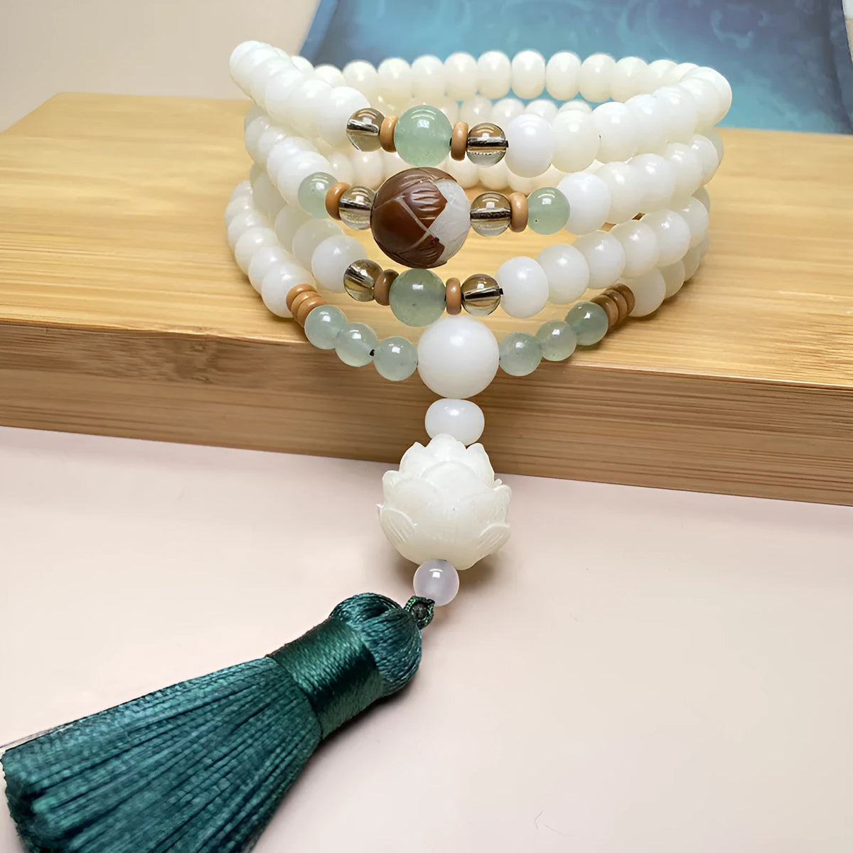 White jade bodhi bead bracelet with 108 beads, showing pattern and size options.