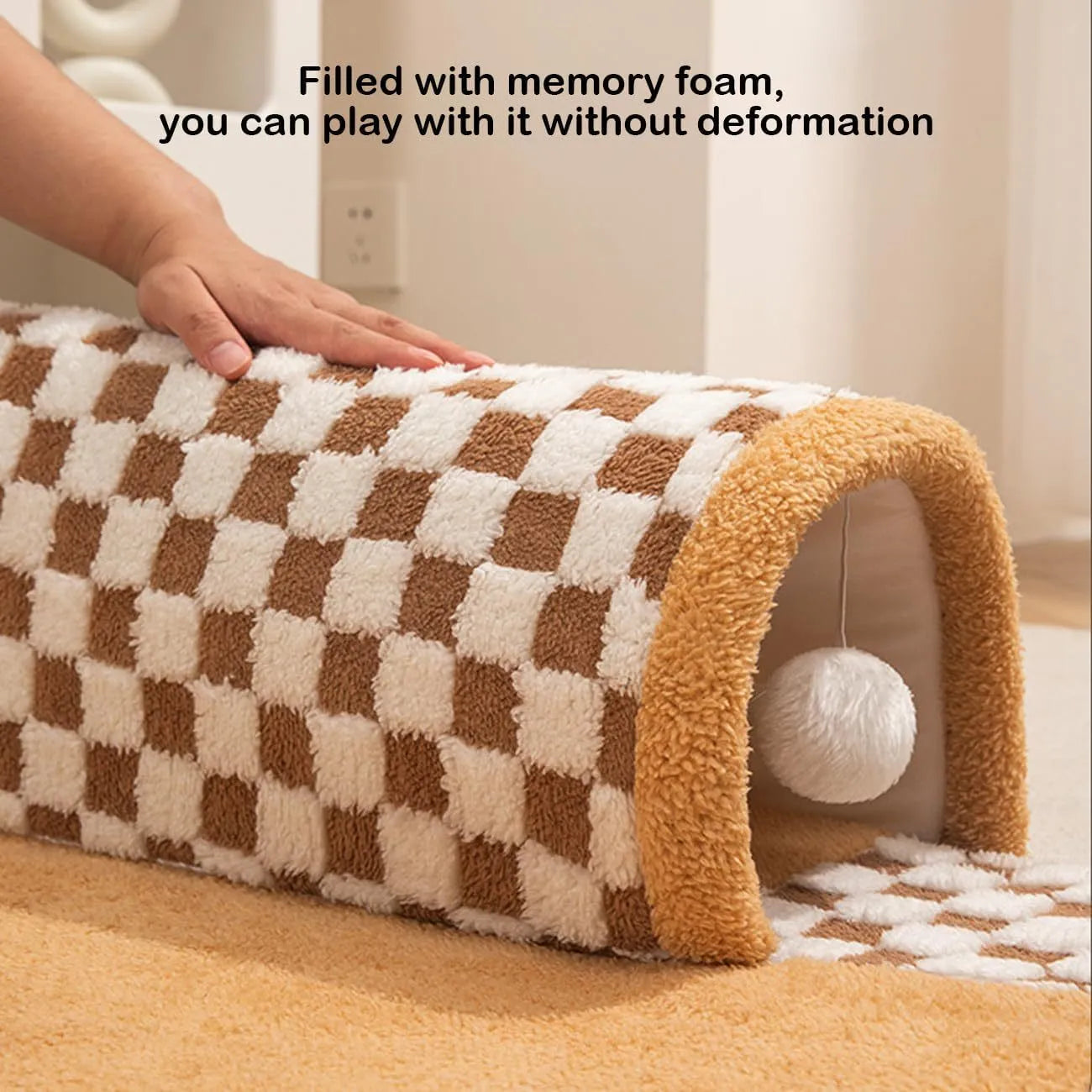 A coffee-coloured plush fan-shaped pet bed with an attached tunnel for cats and dogs.