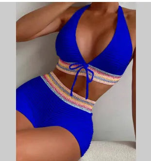 Women's solid colour two-piece bikini swimsuit in navy blue, made from polyester fabric.