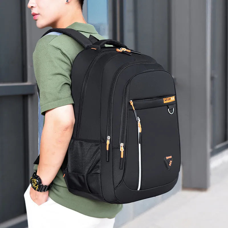 Men's Oxford cloth schoolbag in black with letter pattern detailing showing 20-35L capacity and burden reduction system