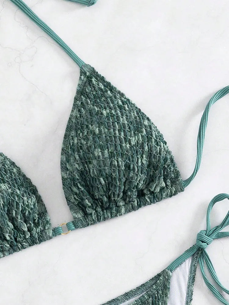 Women's green halter strap backless swimsuit bikini with three-point neck design on mannequin