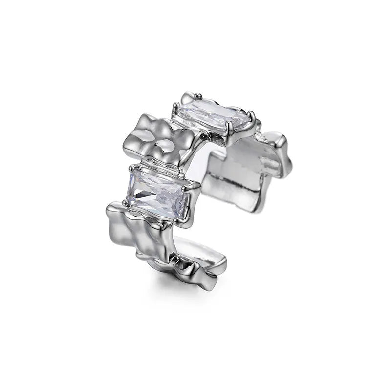Silver geometric cross ring with open gemstone setting and three-dimensional decoration