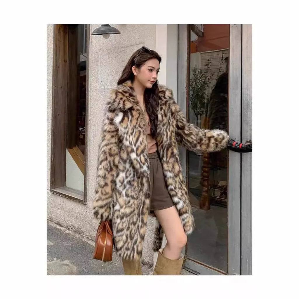 A street-fashion faux fur coat with a fox print pattern and a fur collar, shown in a long style.