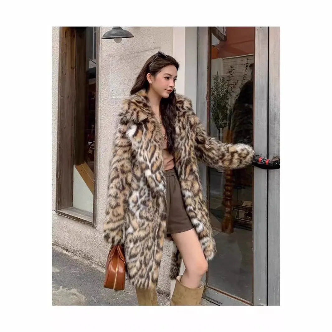 A street-fashion faux fur coat with a fox print pattern and a fur collar, shown in a long style.