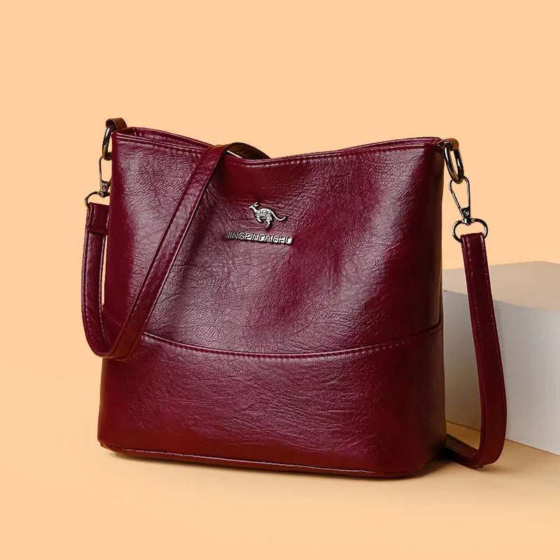 Women's soft leather shoulder bag in bucket shape with sewing line detailing and large capacity