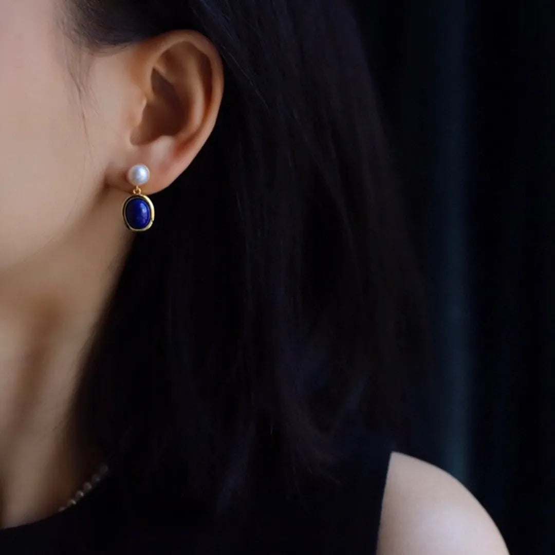 Simple drop earrings with a blue Lapis Lazuli pearl set in sterling silver, featuring auspicious pattern details.