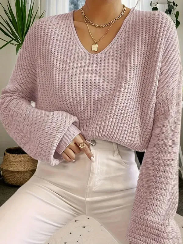 Women's solid colour long sleeve polyester pullover jumper in a loose casual fit.