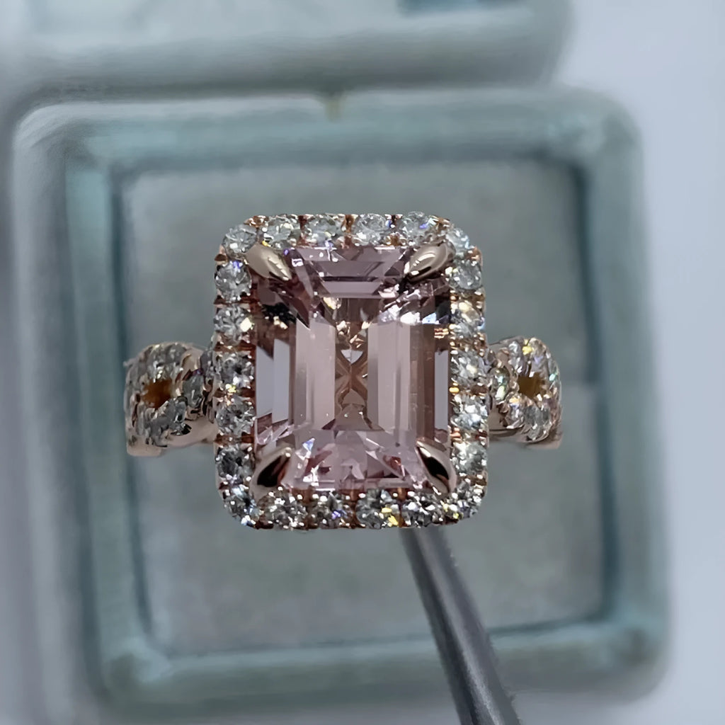 Geometric rose gold coloured alloy ring on a plain background.