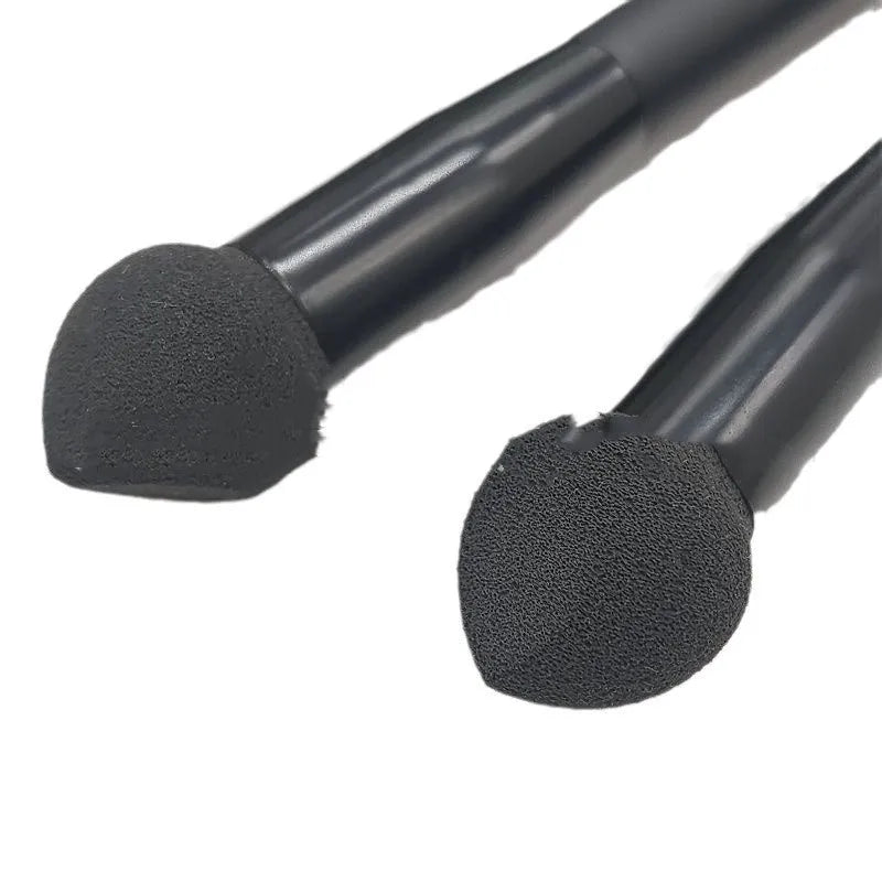 Black sponge stick concealer brush with wooden handle for under-eye makeup application