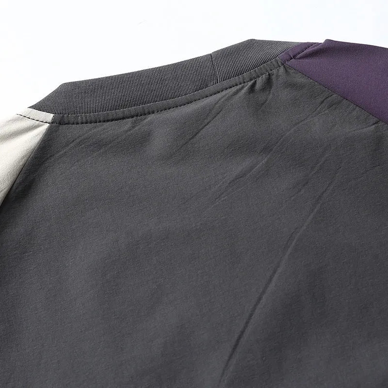Dark grey loose fit men's T-shirt with contrast colour raglan short sleeves.