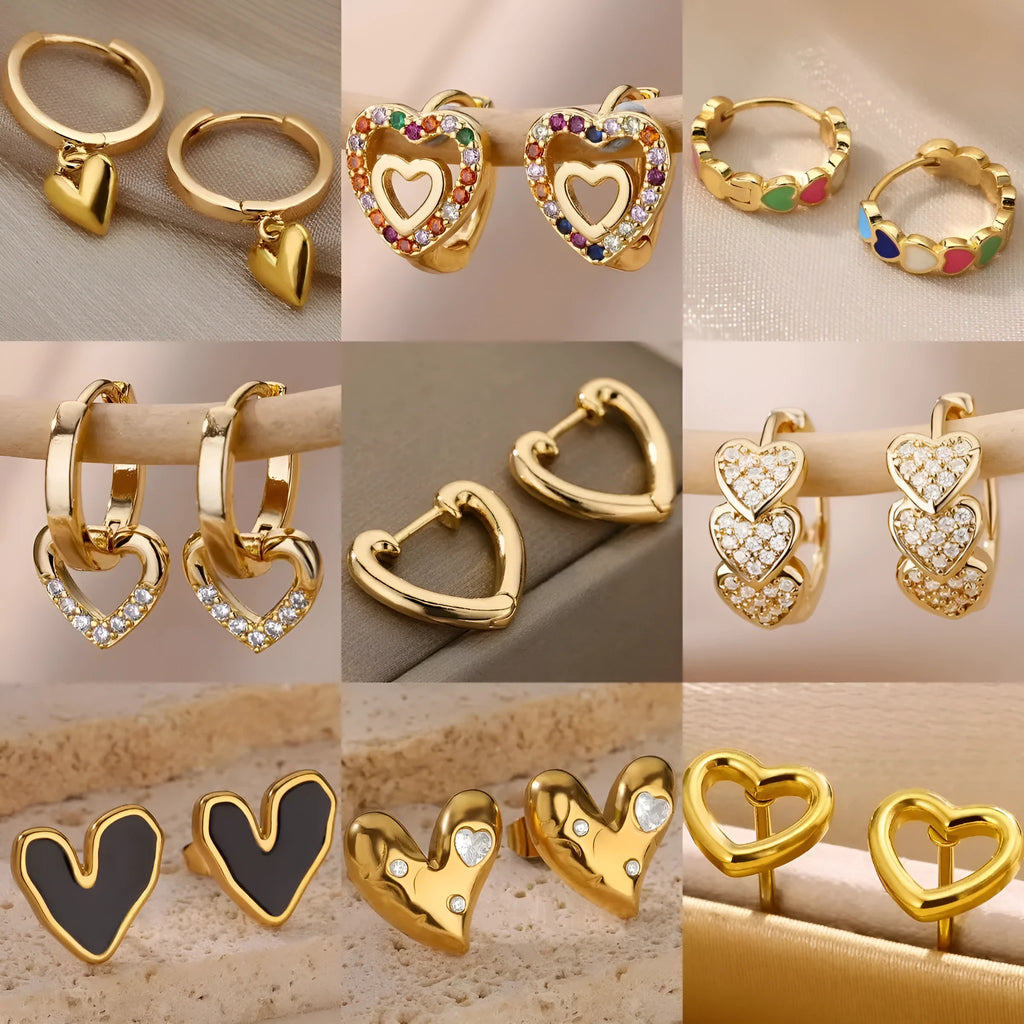 A pair of stainless steel heart-shaped ear studs with zircon accents and an ear clip fastening.