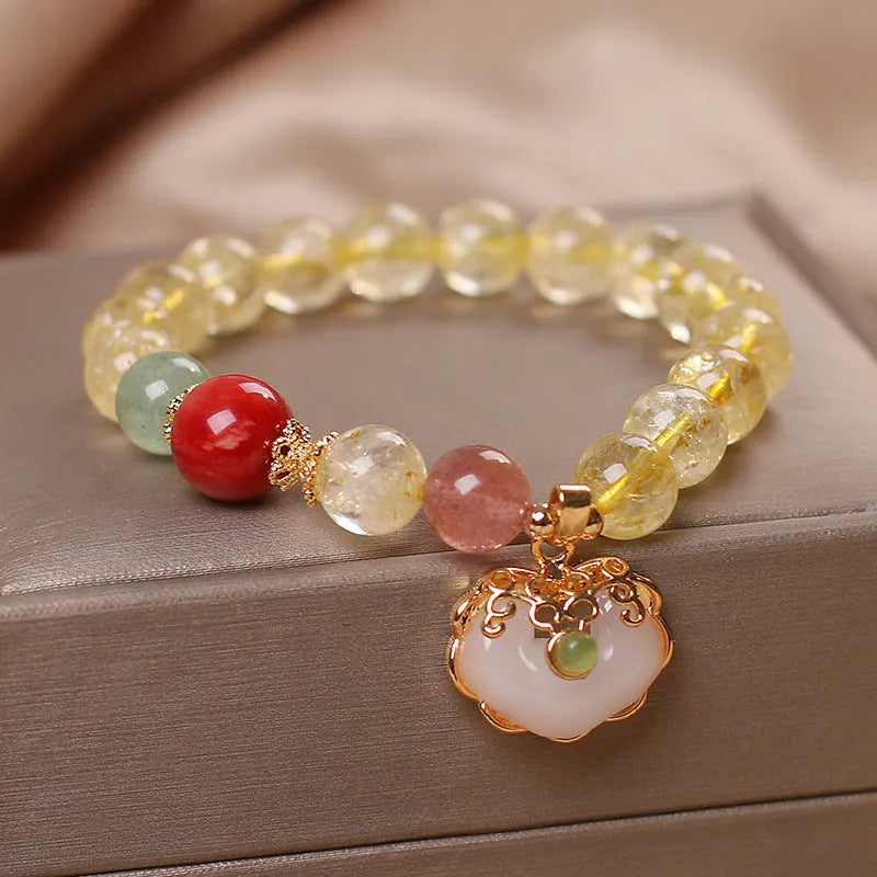 Women's alloy bracelet with a yellow hair crystal jade ruyi pendant charm.