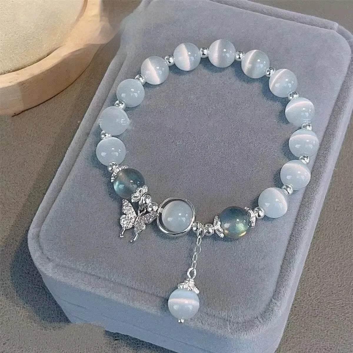 Handmade glass butterfly bracelet with coloured glaze and drop-shaped elements in grey moonlight beads