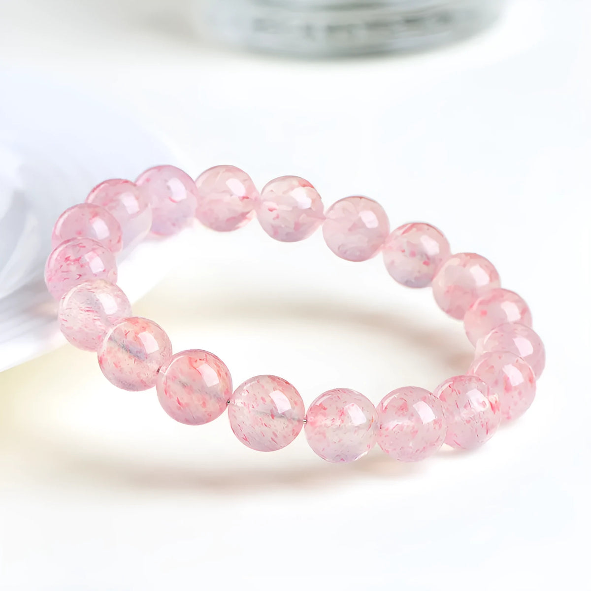 Natural white water strawberry quartz crystal bracelet with 19 round beads measuring 10-10.8mm