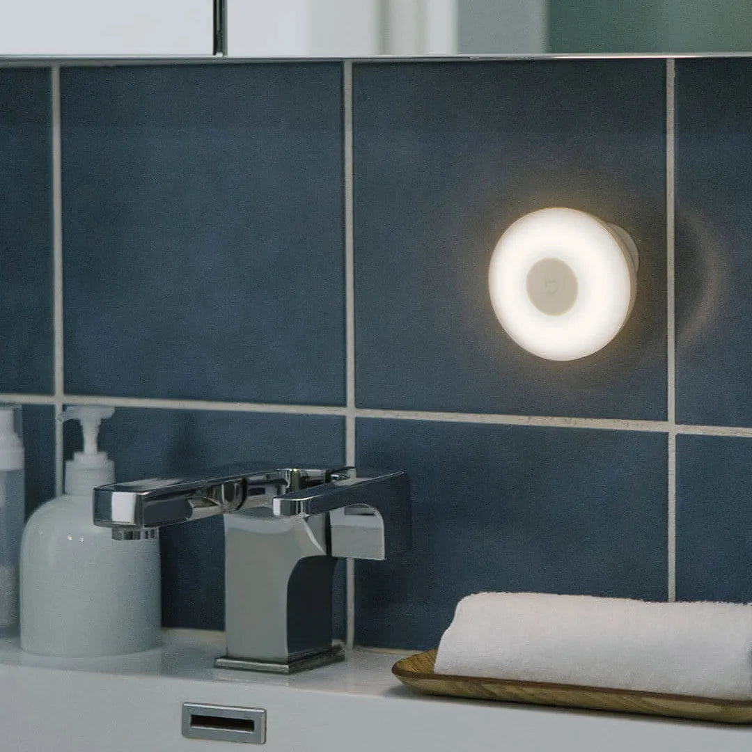 White modern bedside table lamp with Bluetooth and human body sensor.