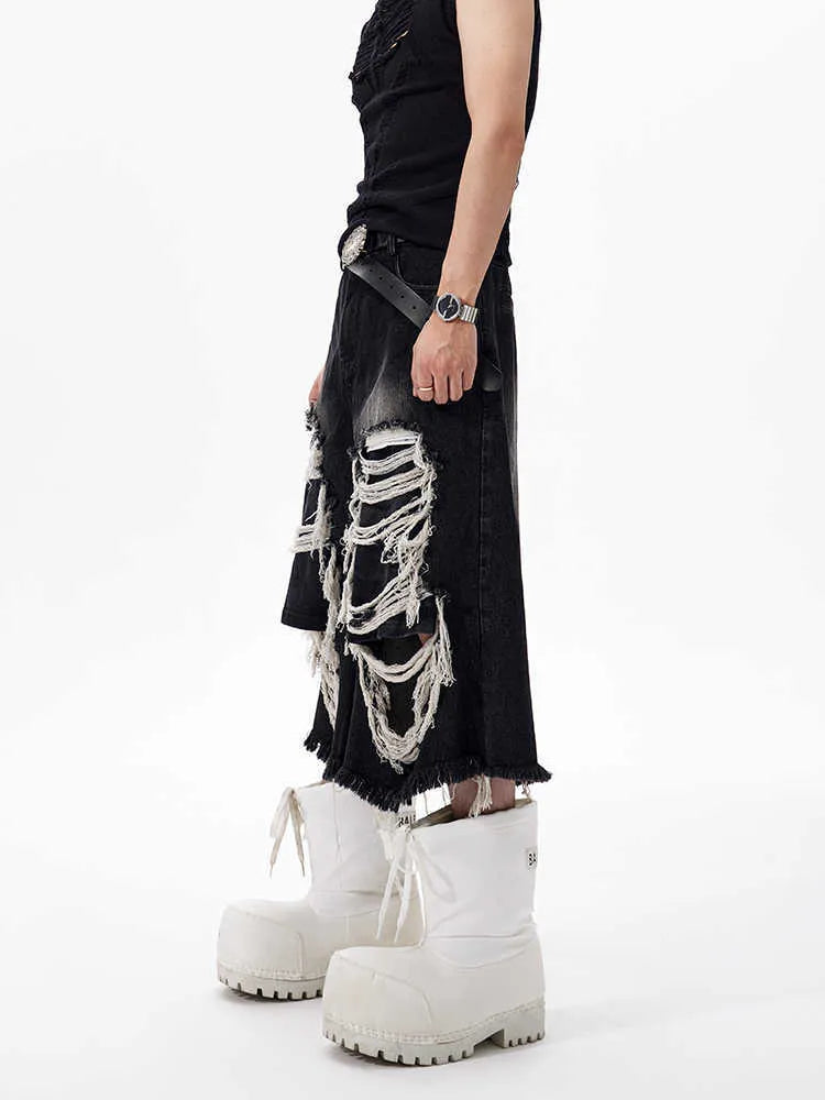 Women's black cropped wide leg jeans with mid-high waist and ripped patch detailing