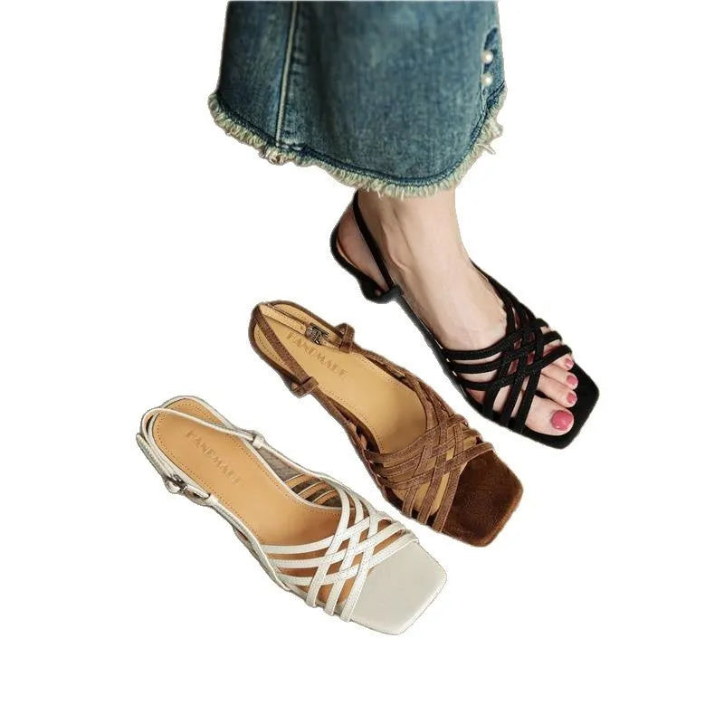 Retro women's sandals with thin cross straps, ankle buckle, square toe, and a mid heel.