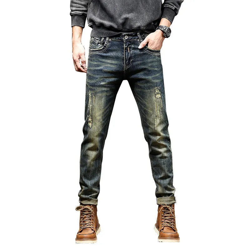 Men's skinny fit jeans in retro blue denim with a zip fly, shown laid flat.