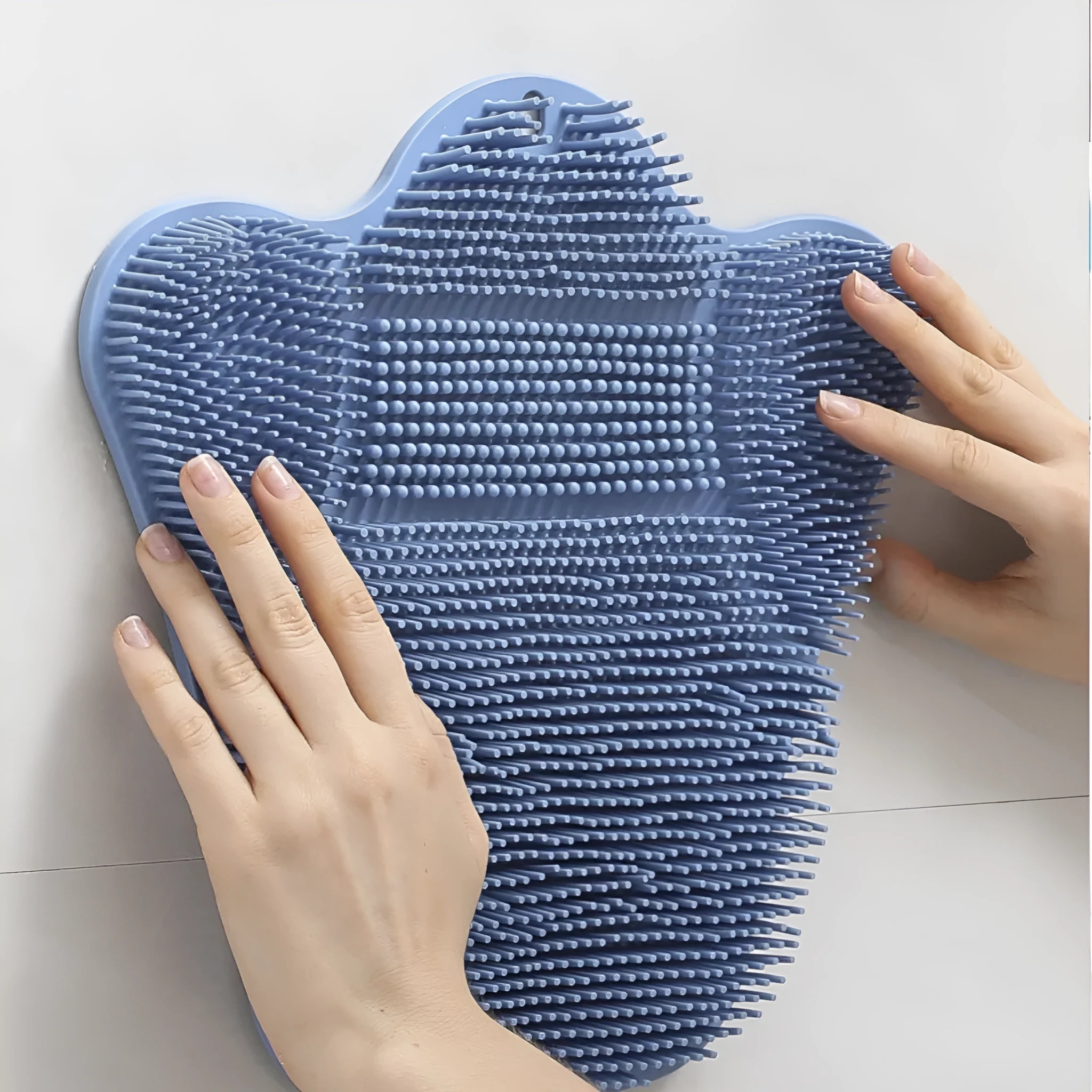 Blue silicone bath massage cushion for back scrubbing, measuring 31 by 32 centimetres