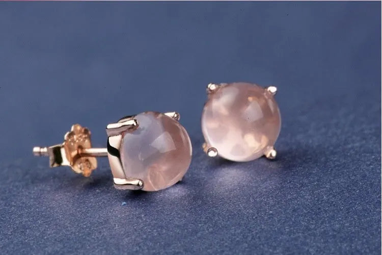 Rose gold plated copper stud earrings with synthetic ross quartz and crystal inlay in drop shape