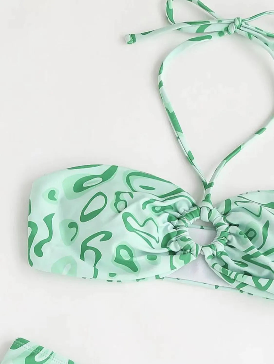 Women's blue floral bandeau bikini with split design and backless styling for swimming