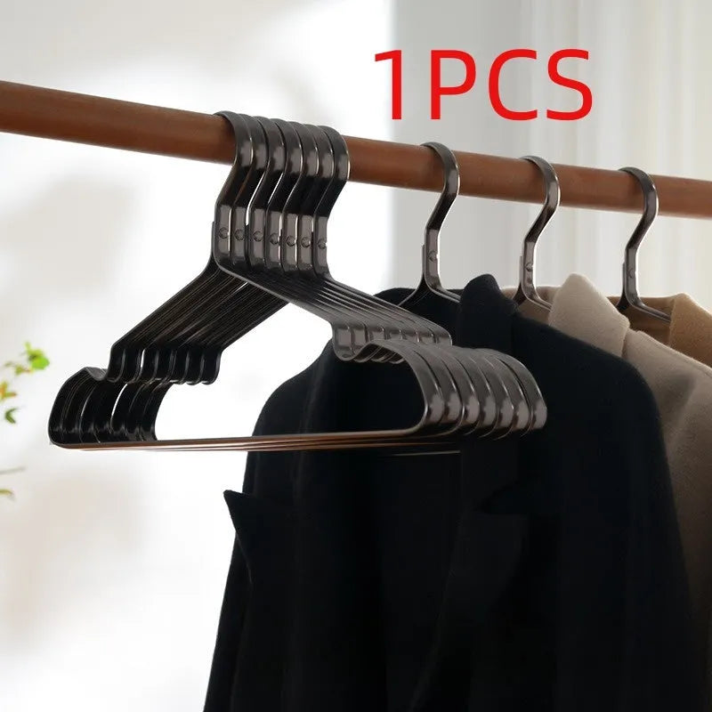 Black plastic clothes hangers with non-slip anti-rust coating for wardrobe organisation