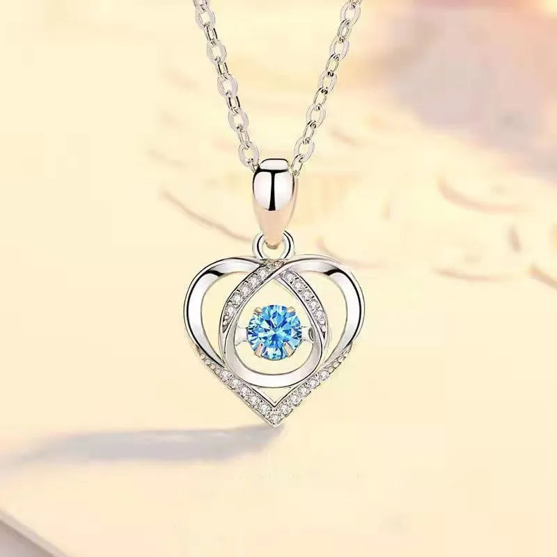 Blue diamond coloured beating heart necklace and bracelet set with gem inlaid pendant on electroplated copper.