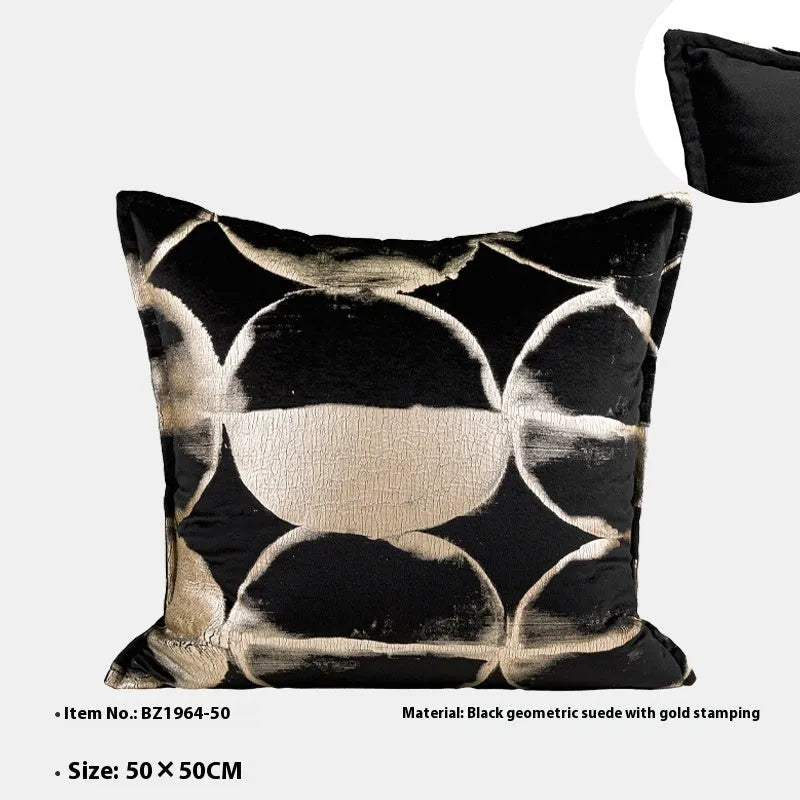 Black gold abstract pattern decorative cushion with removable cover in three size options on a sofa.