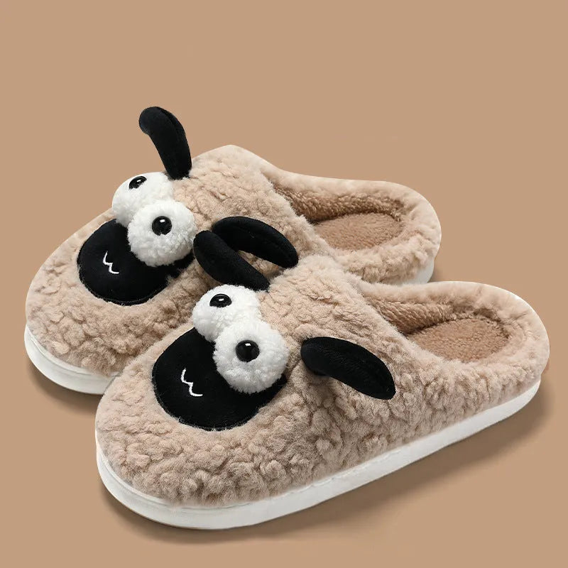 A pair of lamb thermal cotton slip-on slippers with a suede upper and sewn PVC sole.