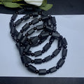 Natural black tourmaline rough stone bracelet with approximately 9mm beads and seiko polished finish