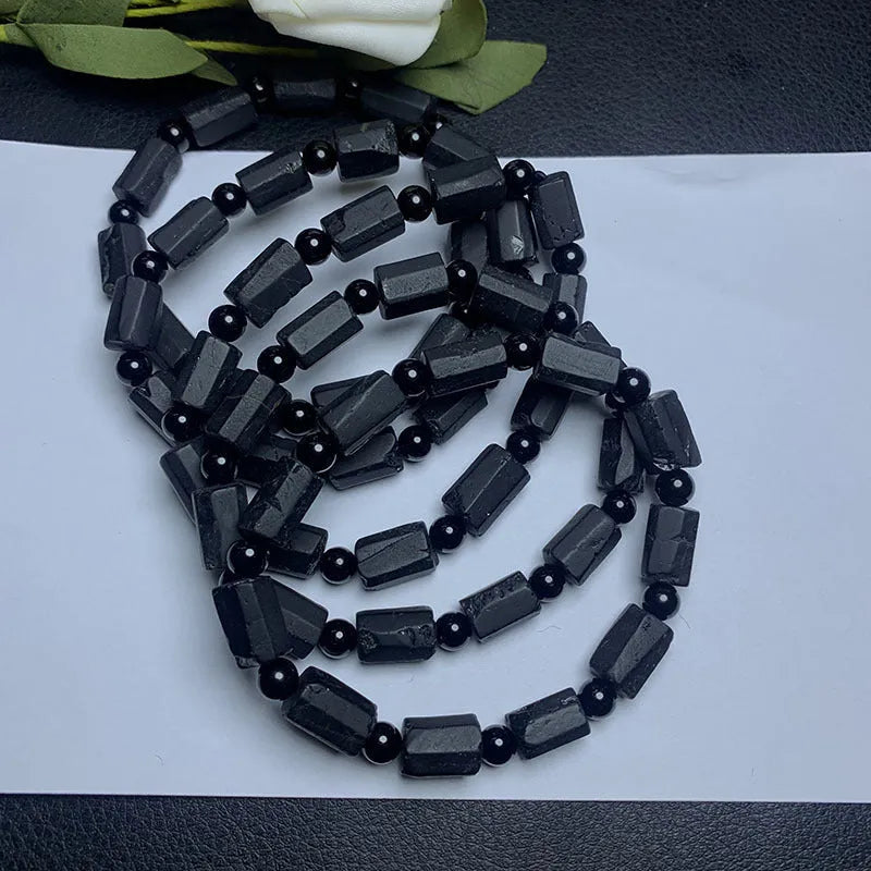Natural black tourmaline rough stone bracelet with approximately 9mm beads and seiko polished finish