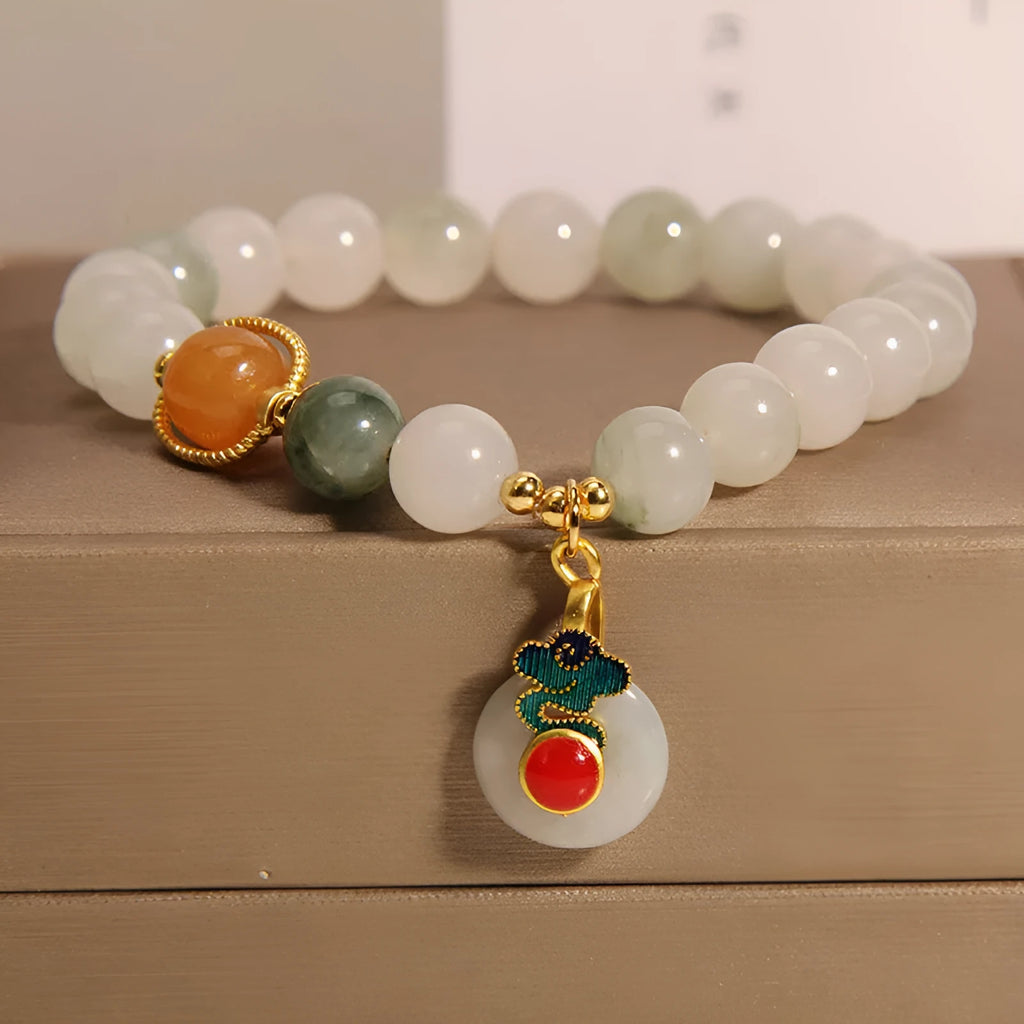 Ice jade bracelet for women with pearl charm and jade buckle in Chinese retro style.