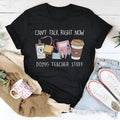 Black loose-fit cotton short-sleeve T-shirt on a hanger.