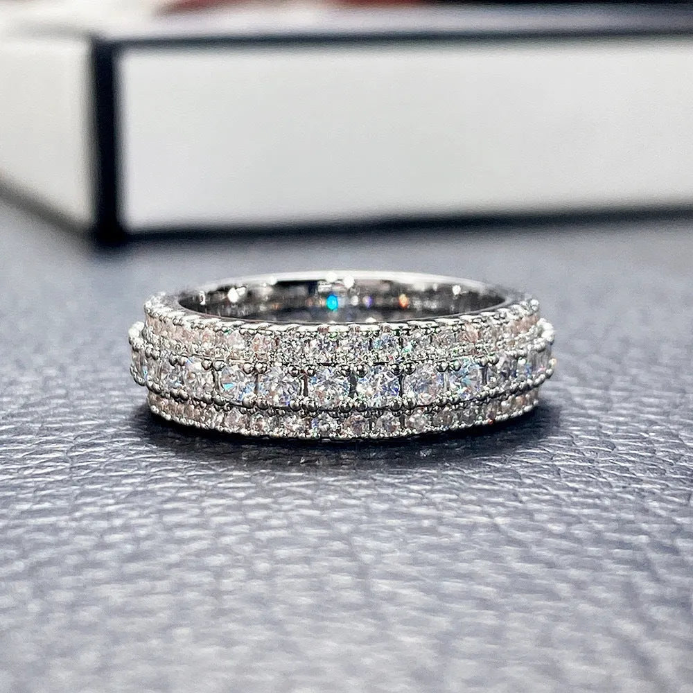 Geometric triangular copper engagement ring with zircon stone inlay, shown in white gold plating.