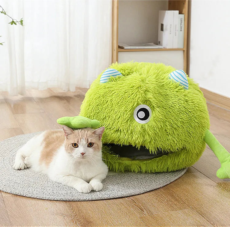 Fluffy round pet bed for cats and small dogs on a wooden floor