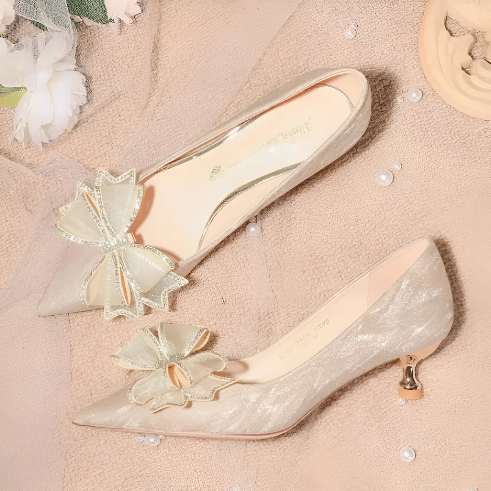 Champagne coloured sequinned women's stiletto pumps with crystal embellishments and pointed toe