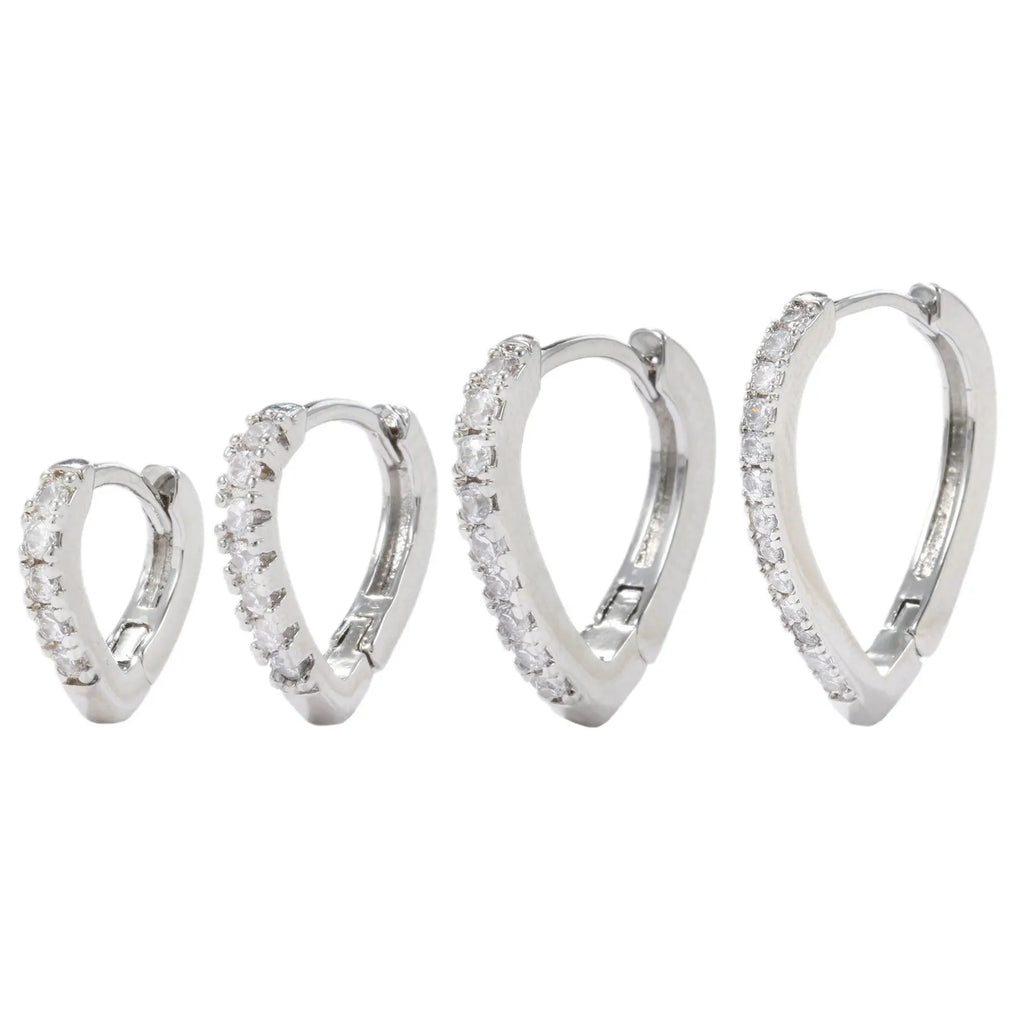 Geometric heart-shaped copper clip-on earring with gold electroplated finish.